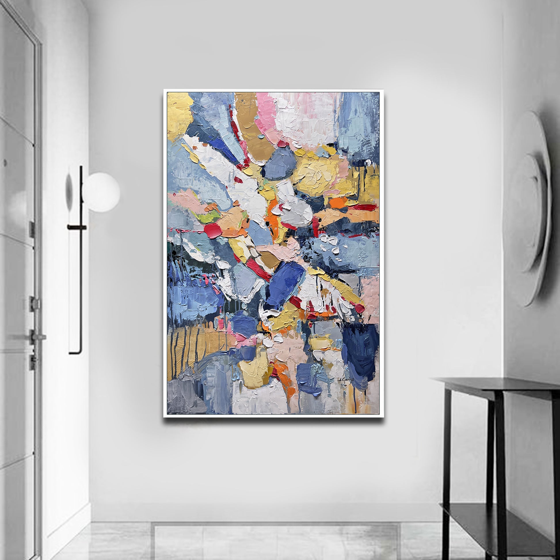 a painting hanging on a wall in a room