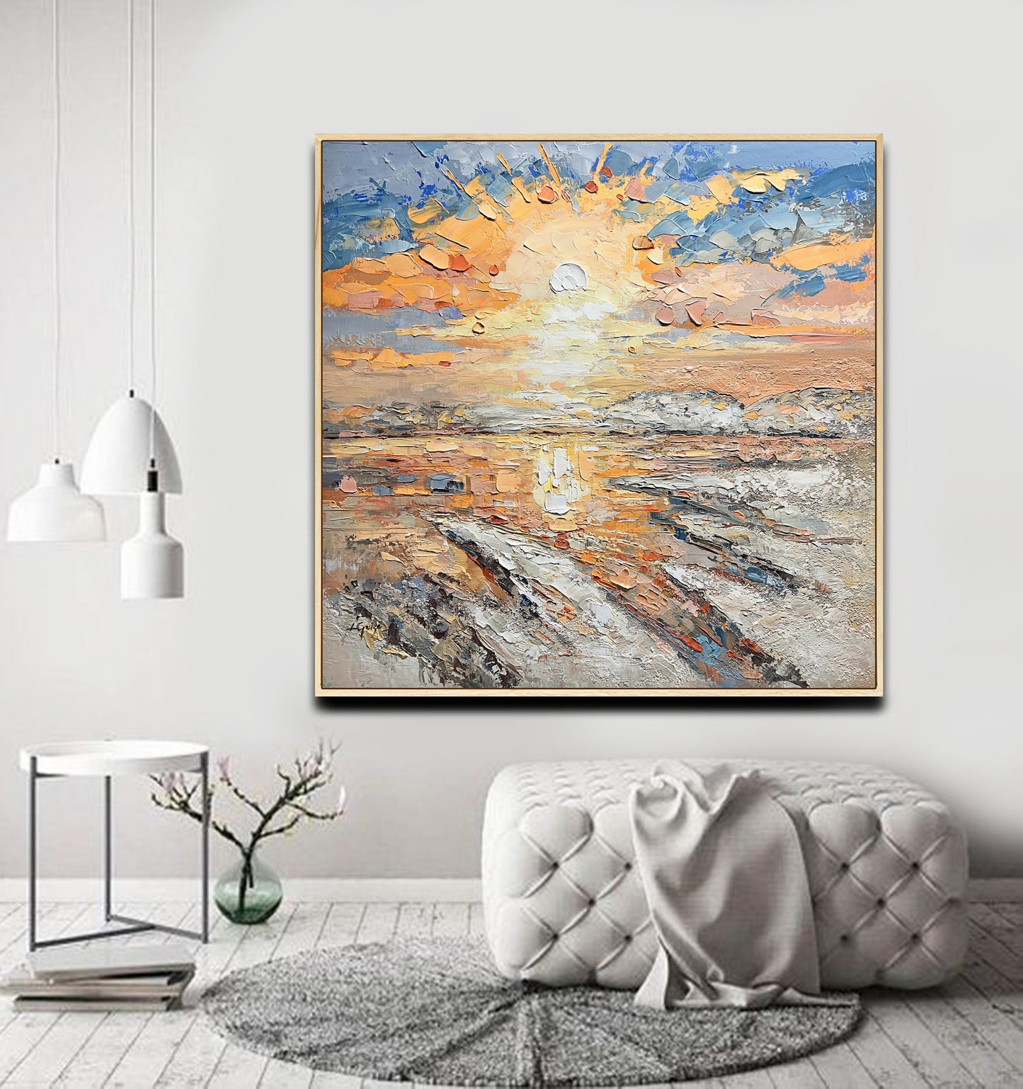 a living room with a couch and a painting on the wall