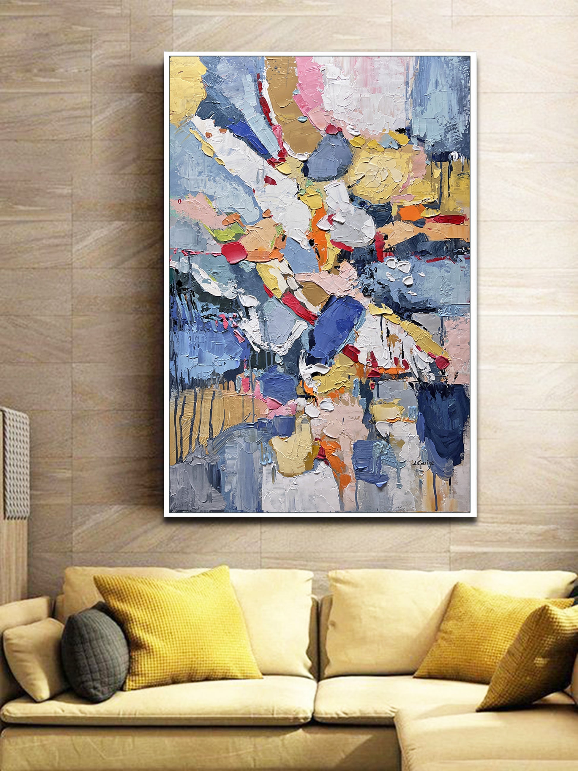 a living room with a couch and a painting on the wall