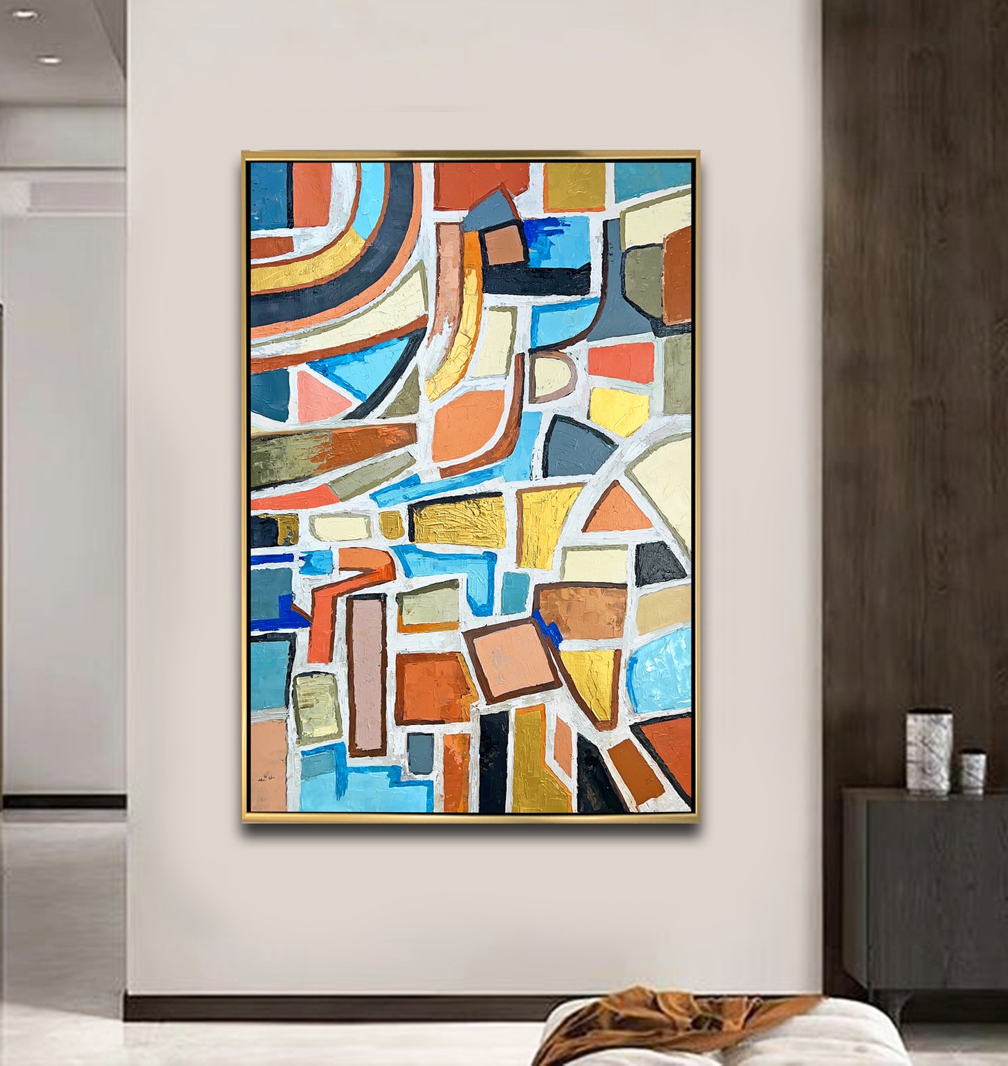 a painting hanging on a wall above a bed