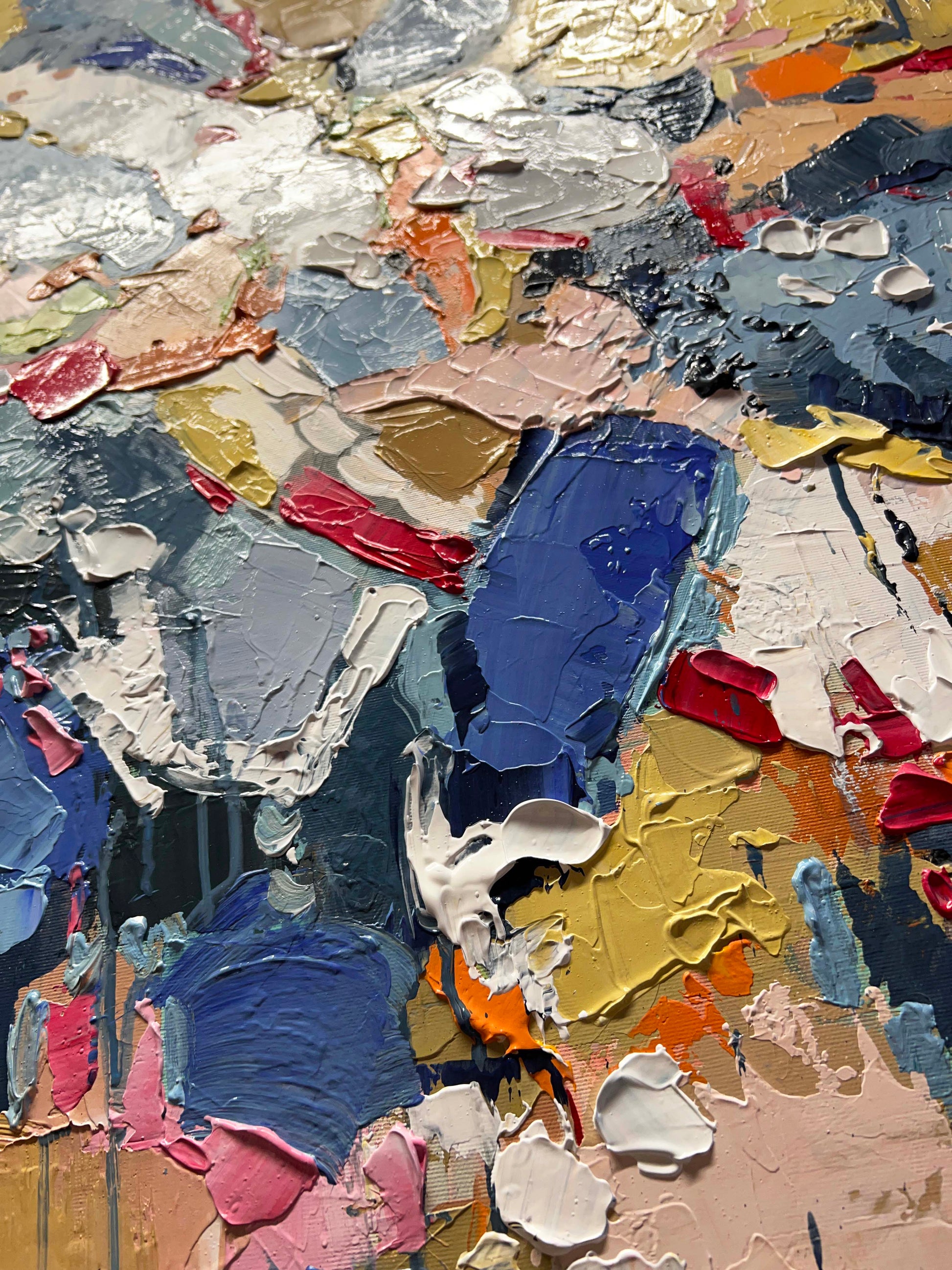 a close up of a painting with many colors of paint