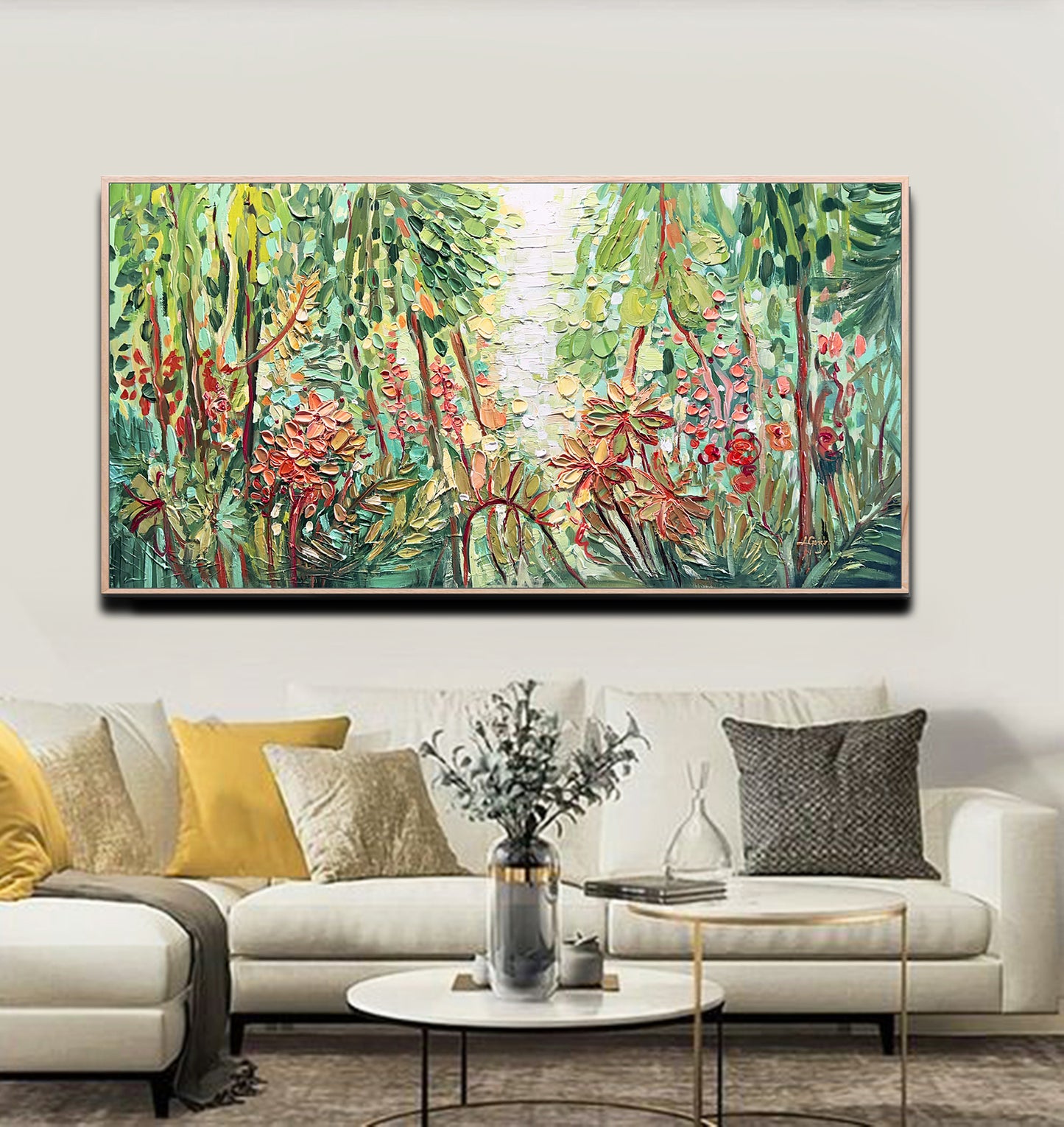 a living room with a couch and a painting on the wall