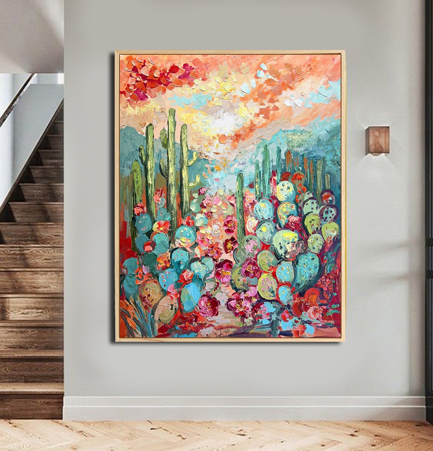 a painting hanging on a wall next to a stair case