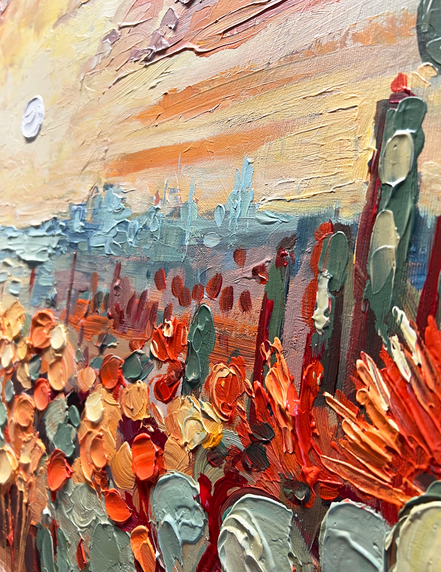 a painting of a desert scene with a sky in the background