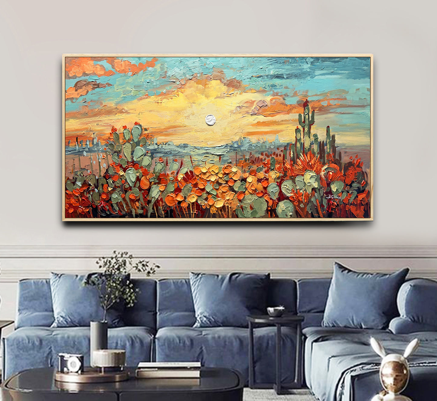 a living room with a couch and a painting on the wall