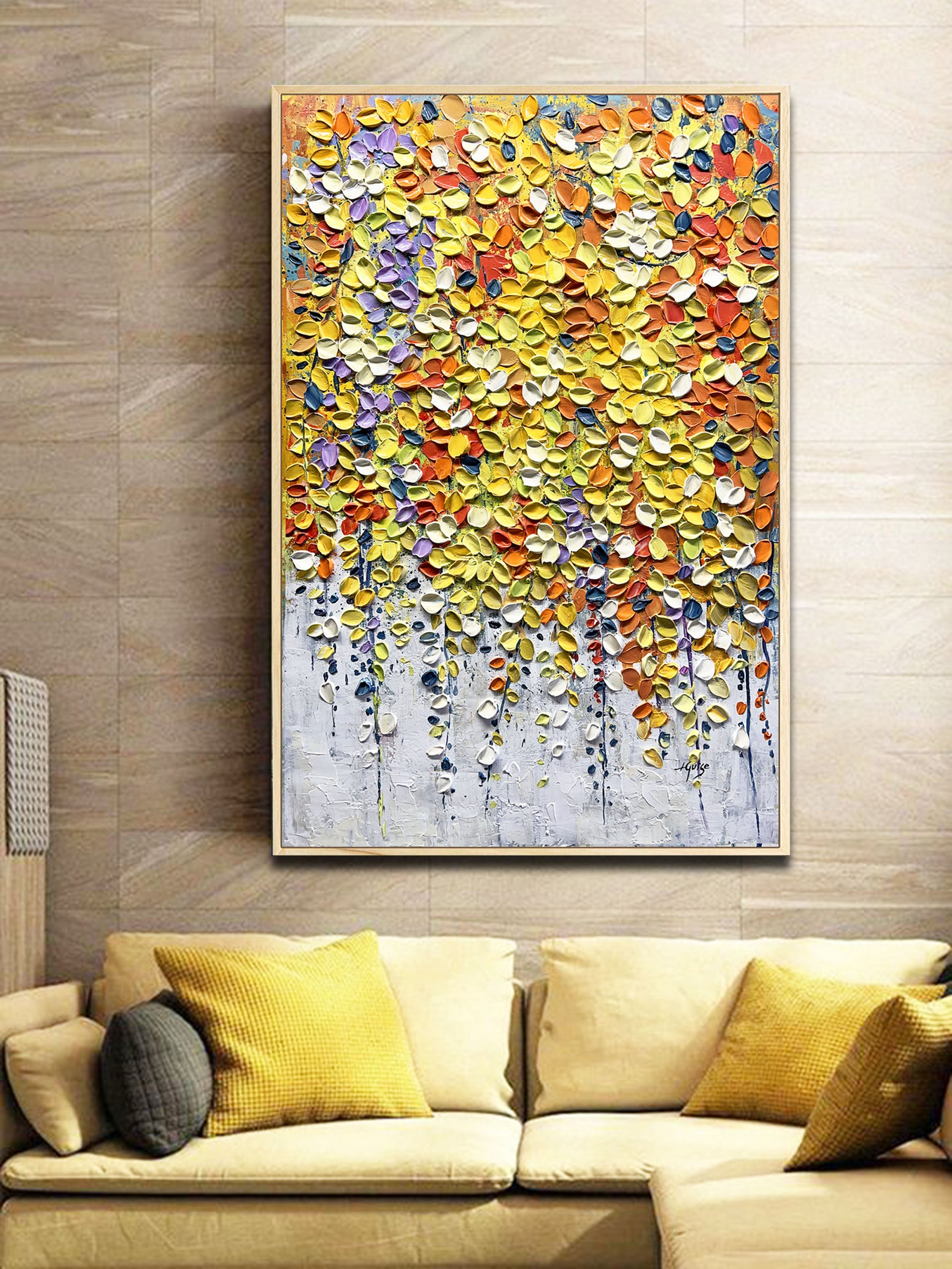 a living room with a couch and a painting on the wall