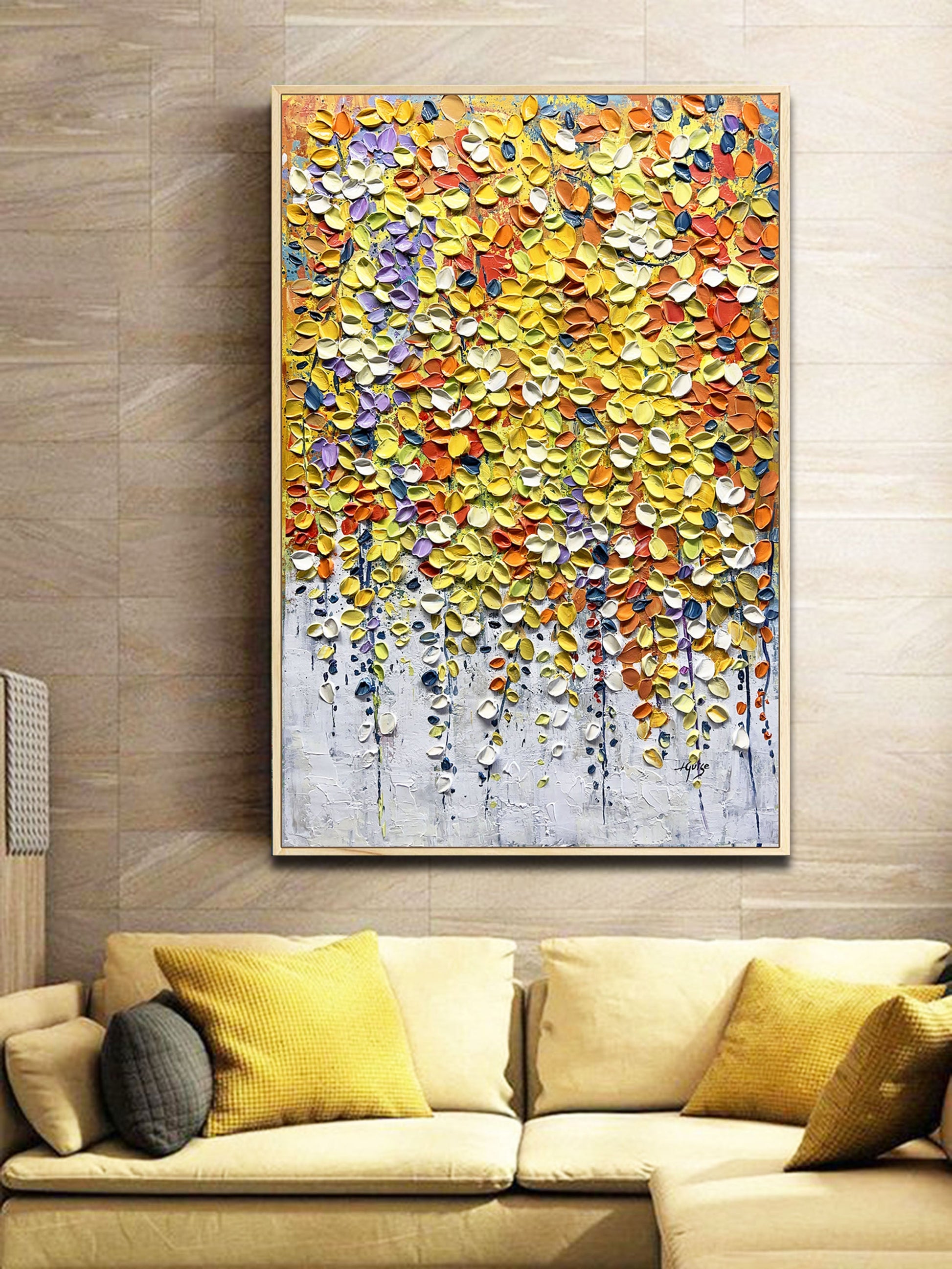 a living room with a couch and a painting on the wall