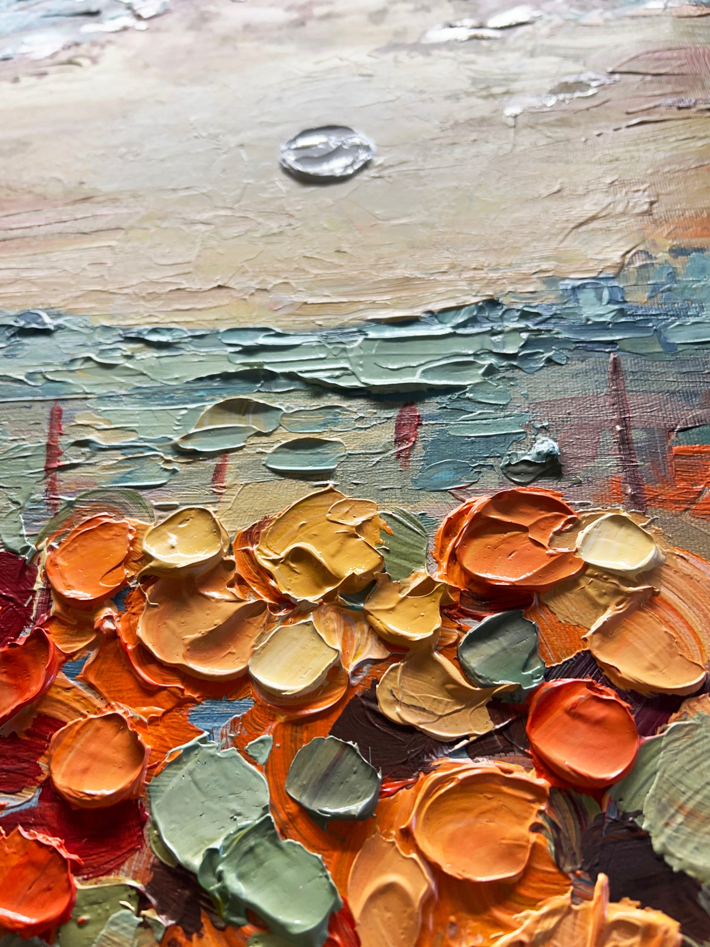 a close up of a painting with many colors of paint