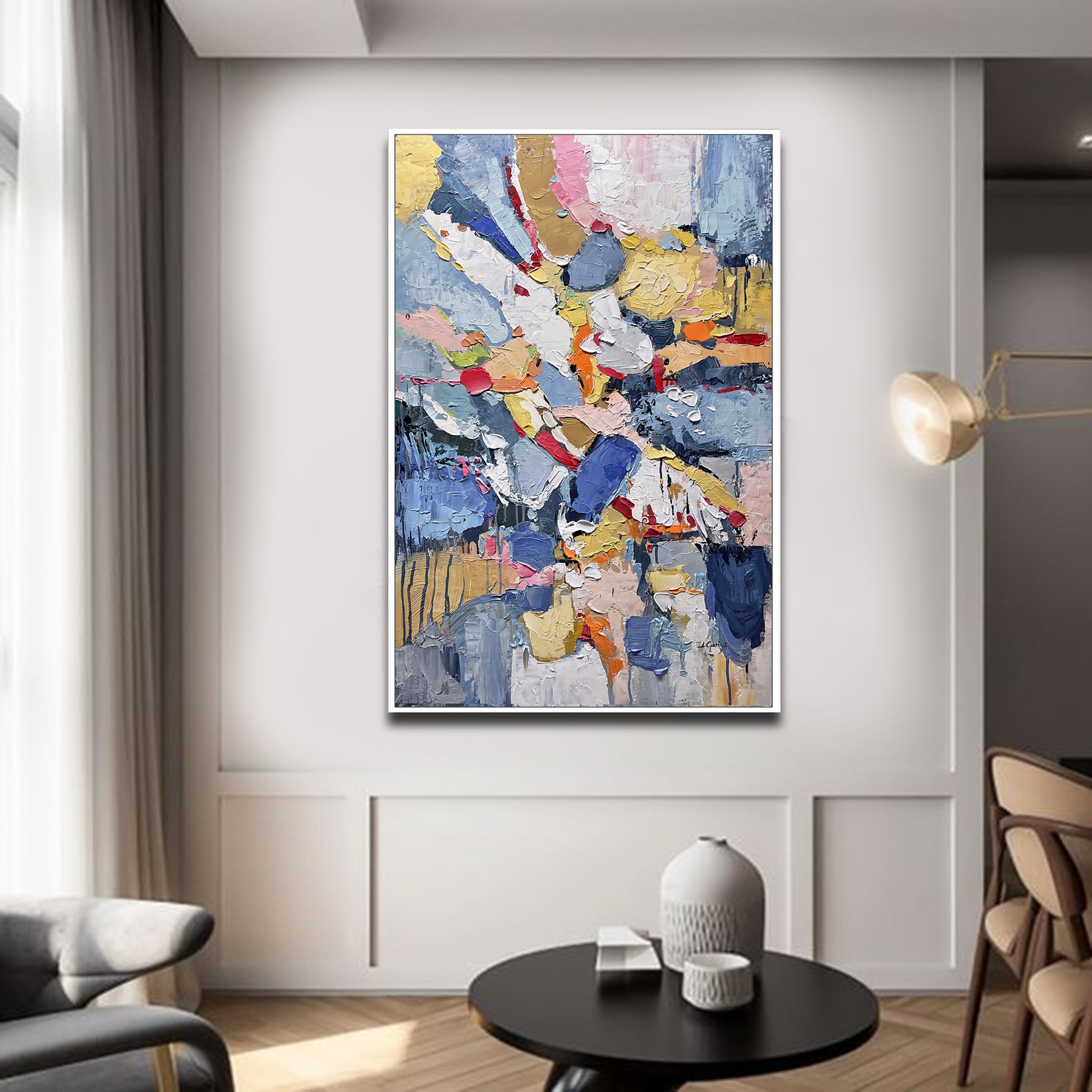 a living room with a large painting on the wall