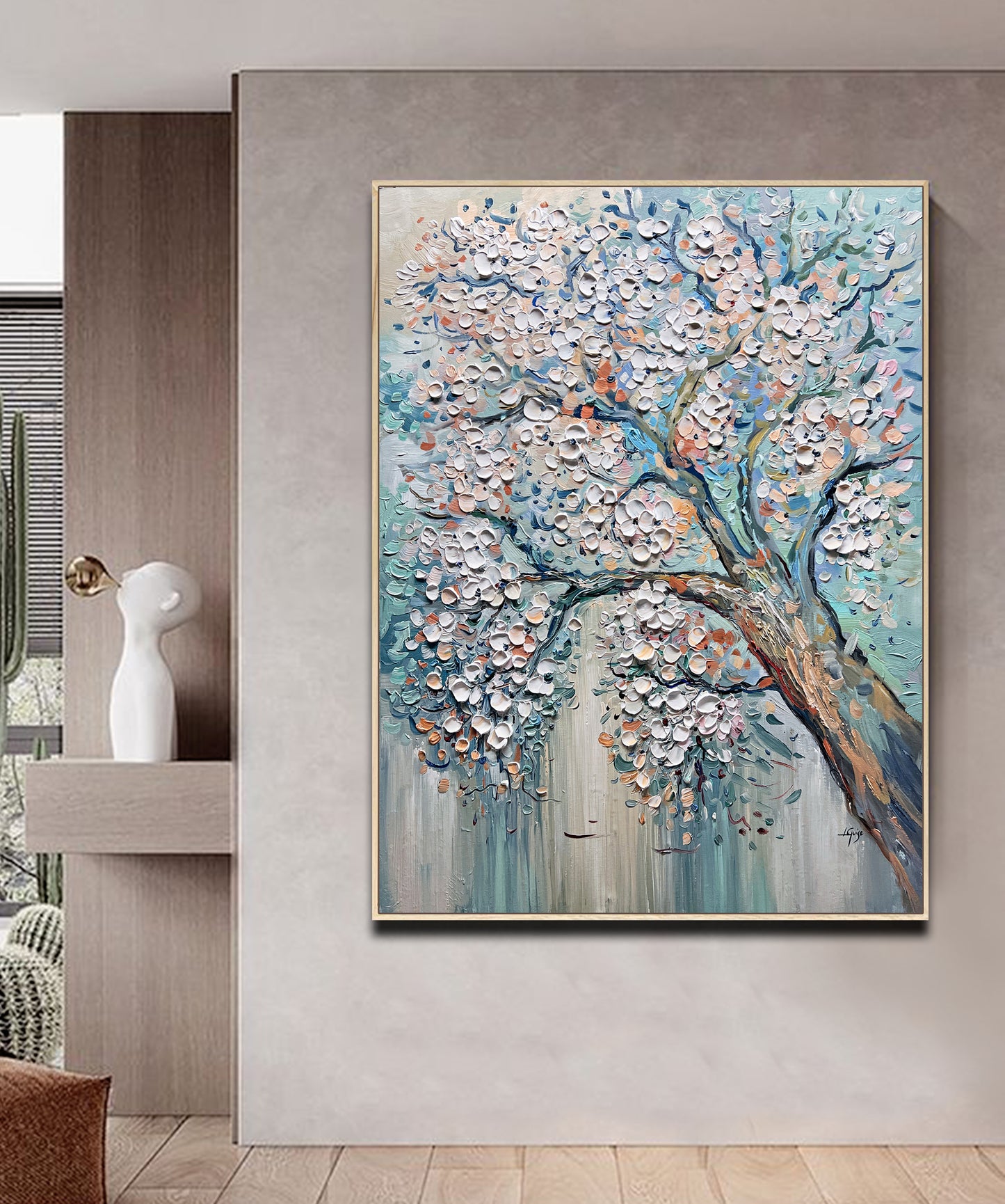 a painting of a tree in a living room