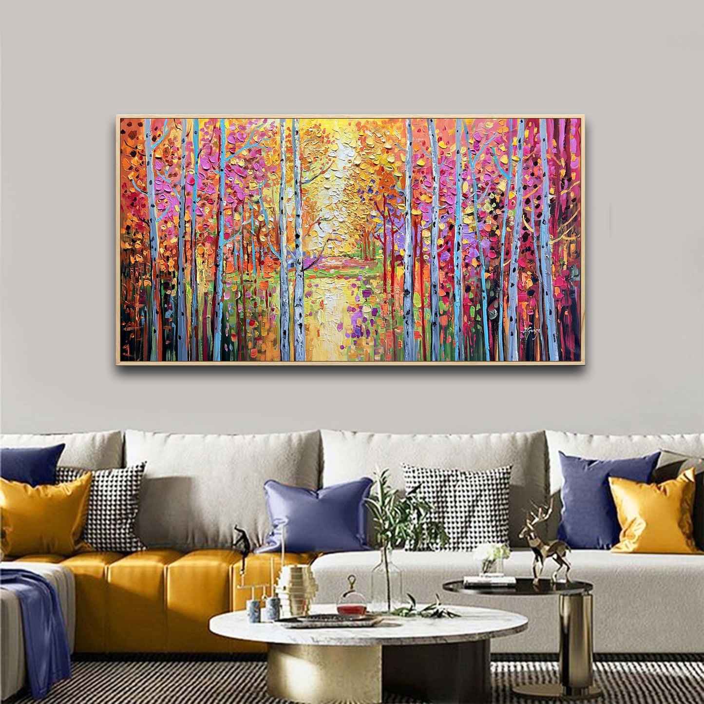 a living room with a couch and a painting on the wall