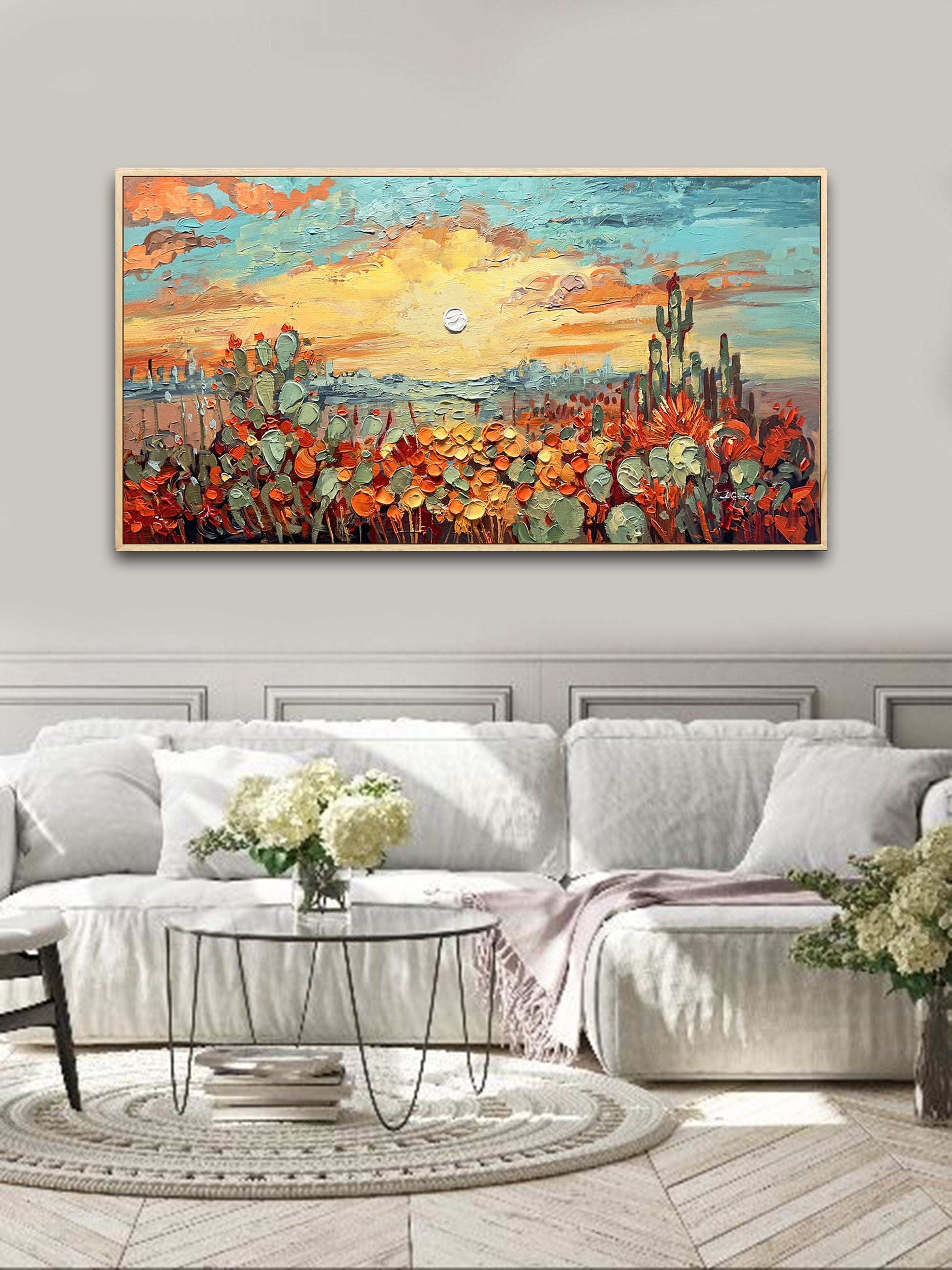 a living room with a couch and a painting on the wall