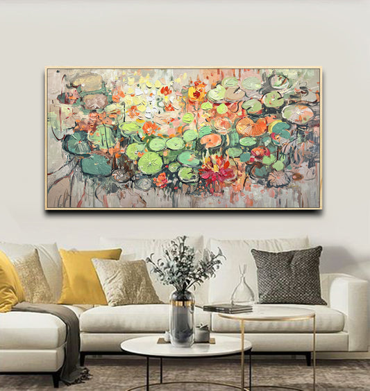 a living room with a couch and a painting on the wall