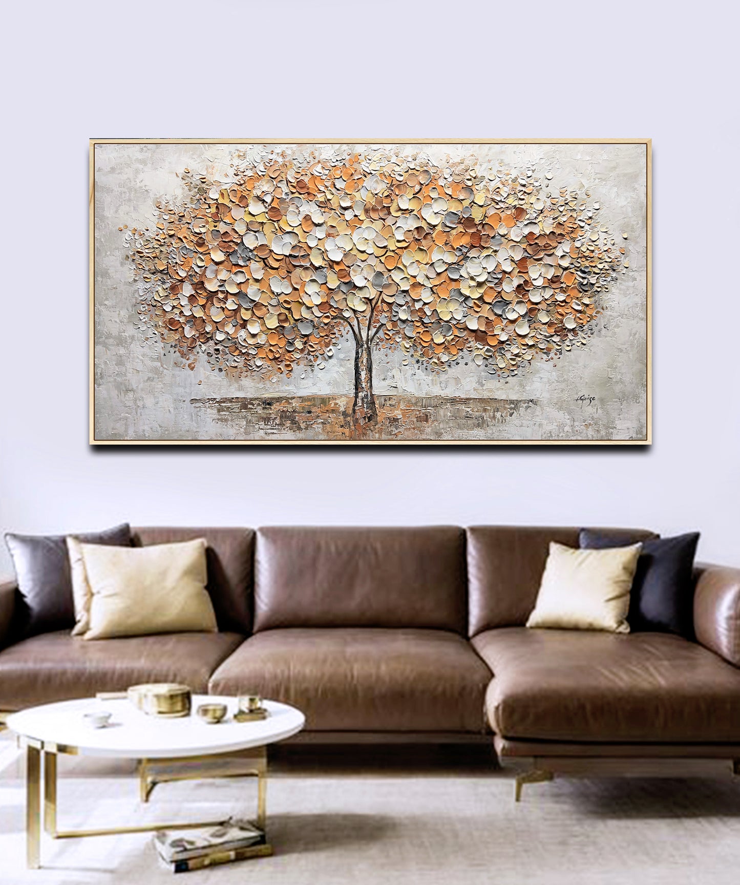 a living room with a couch and a painting on the wall