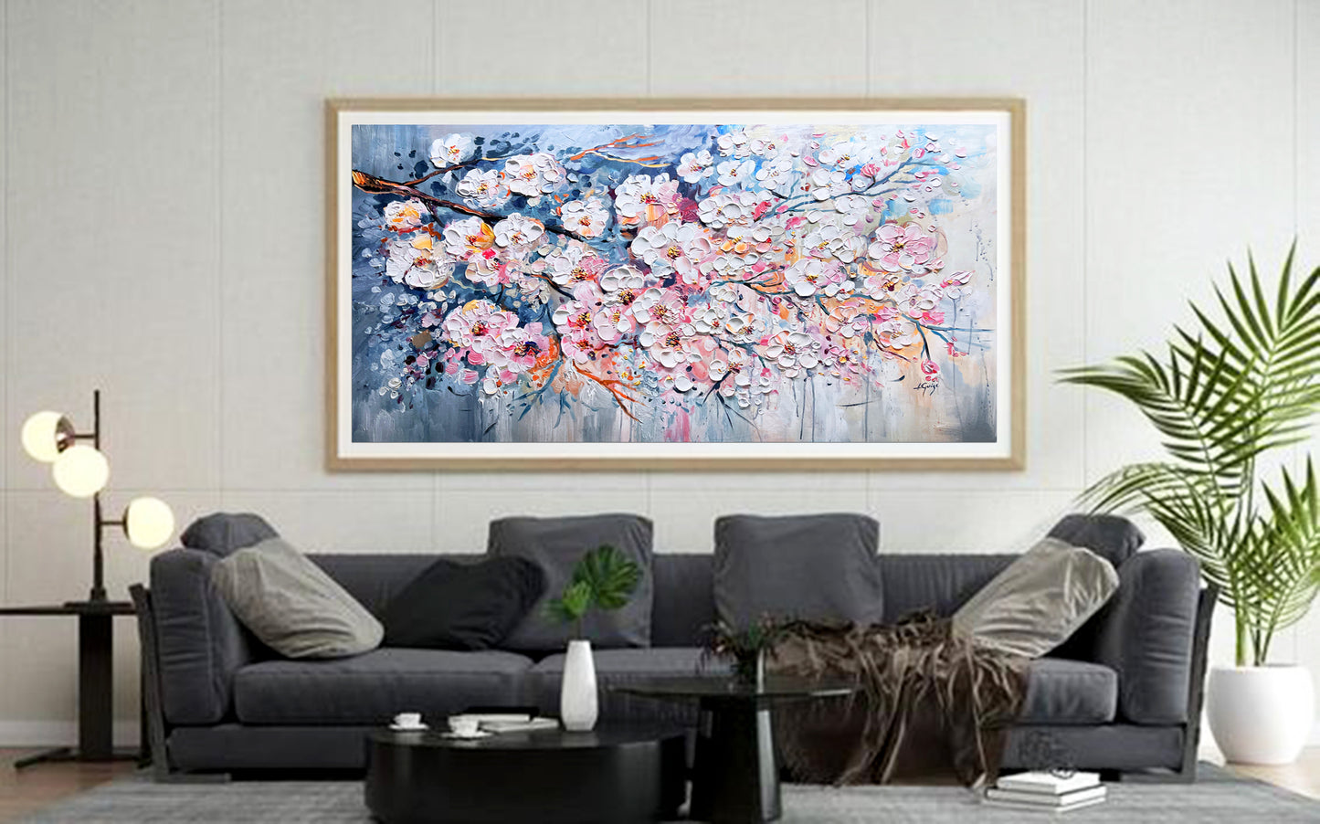 a living room with a couch and a painting on the wall
