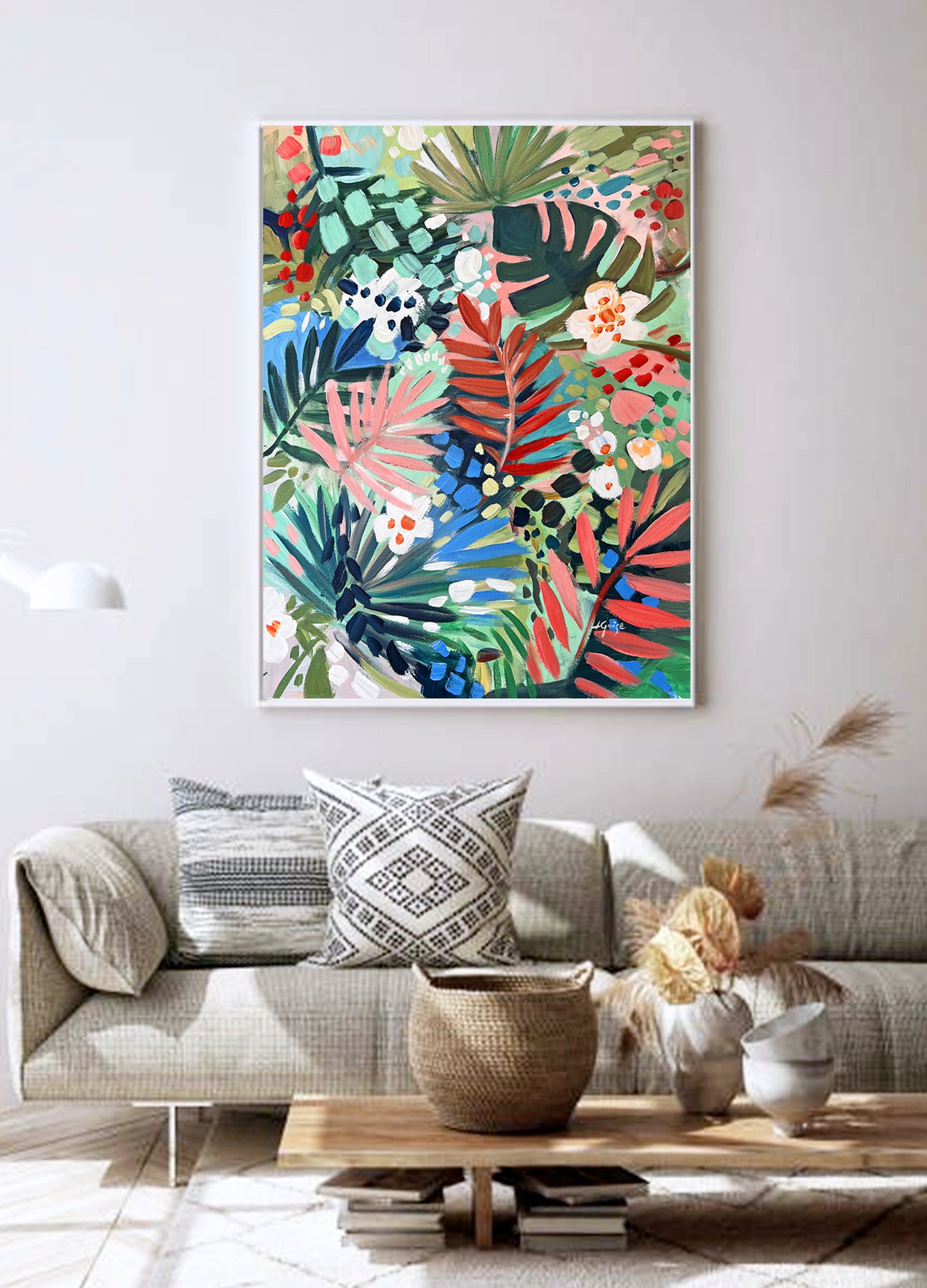 a living room filled with furniture and a painting on the wall