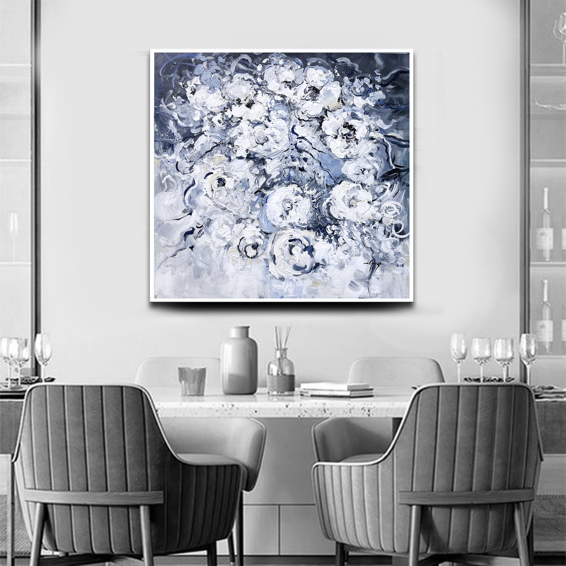 a black and white photo of two chairs and a table