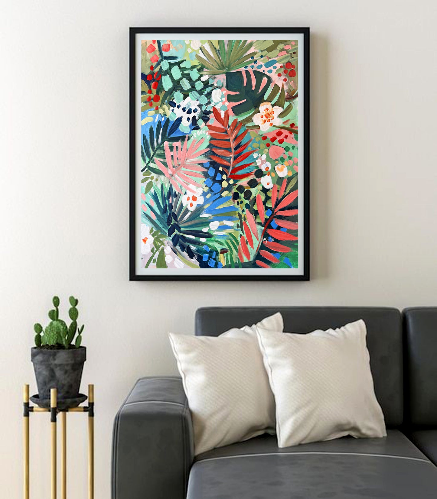 a living room with a couch and a painting on the wall