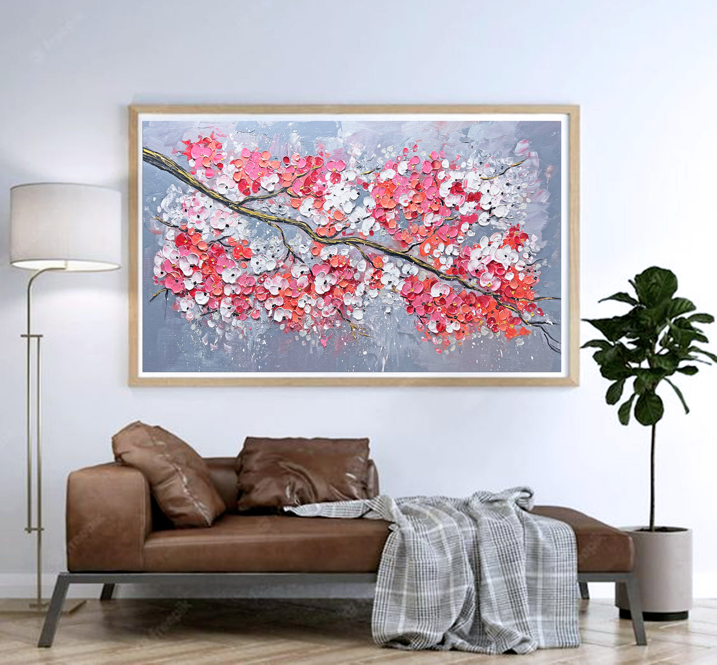 a living room with a couch and a painting on the wall