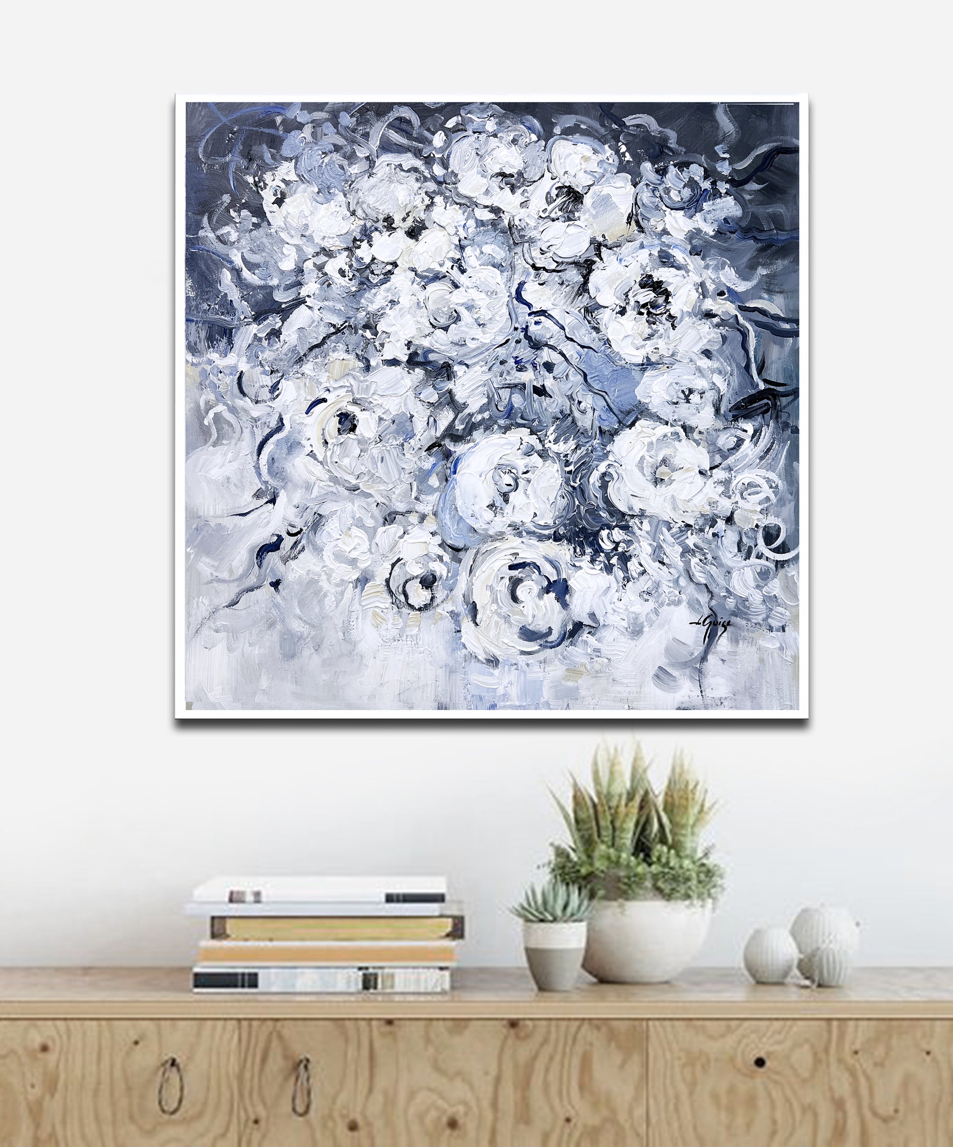 a painting hanging on a wall above a dresser