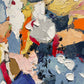 a close up of a painting with many colors of paint