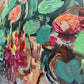 a close up of a painting with flowers on it