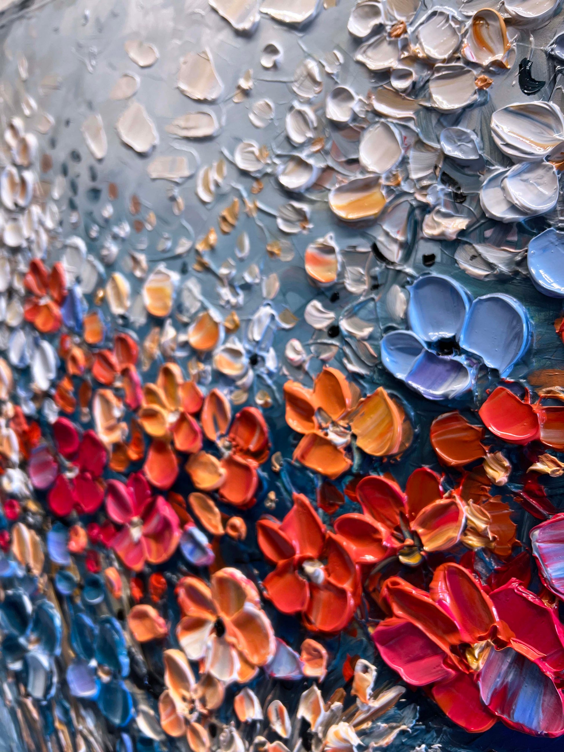 a close up of a glass vase with flowers on it