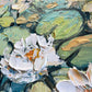 a close up of a painting of water lilies