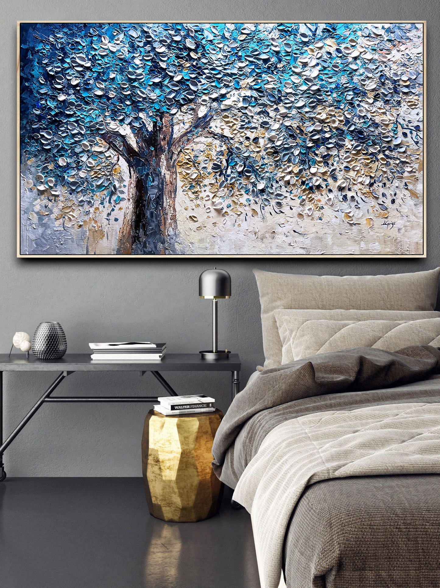 a painting of a tree on a wall above a bed