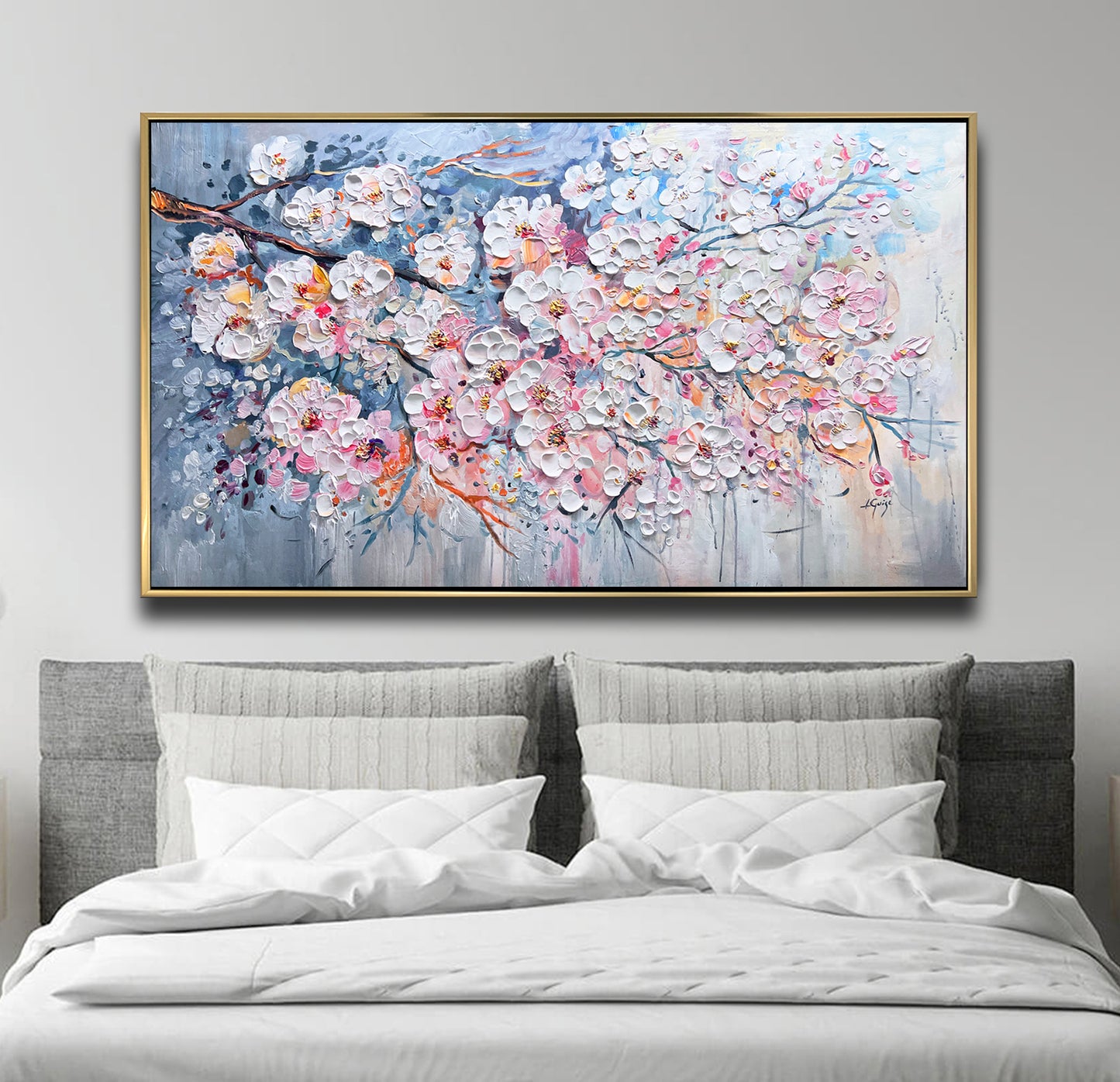 a large painting on a wall above a bed