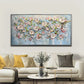 a living room with a couch and a painting on the wall