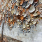 a large piece of art that is on the side of a building
