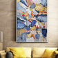 a living room with a couch and a painting on the wall