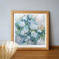 a painting of blue flowers in a wooden frame