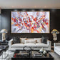 a living room filled with furniture and a large painting