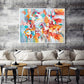 a living room with a large painting on the wall