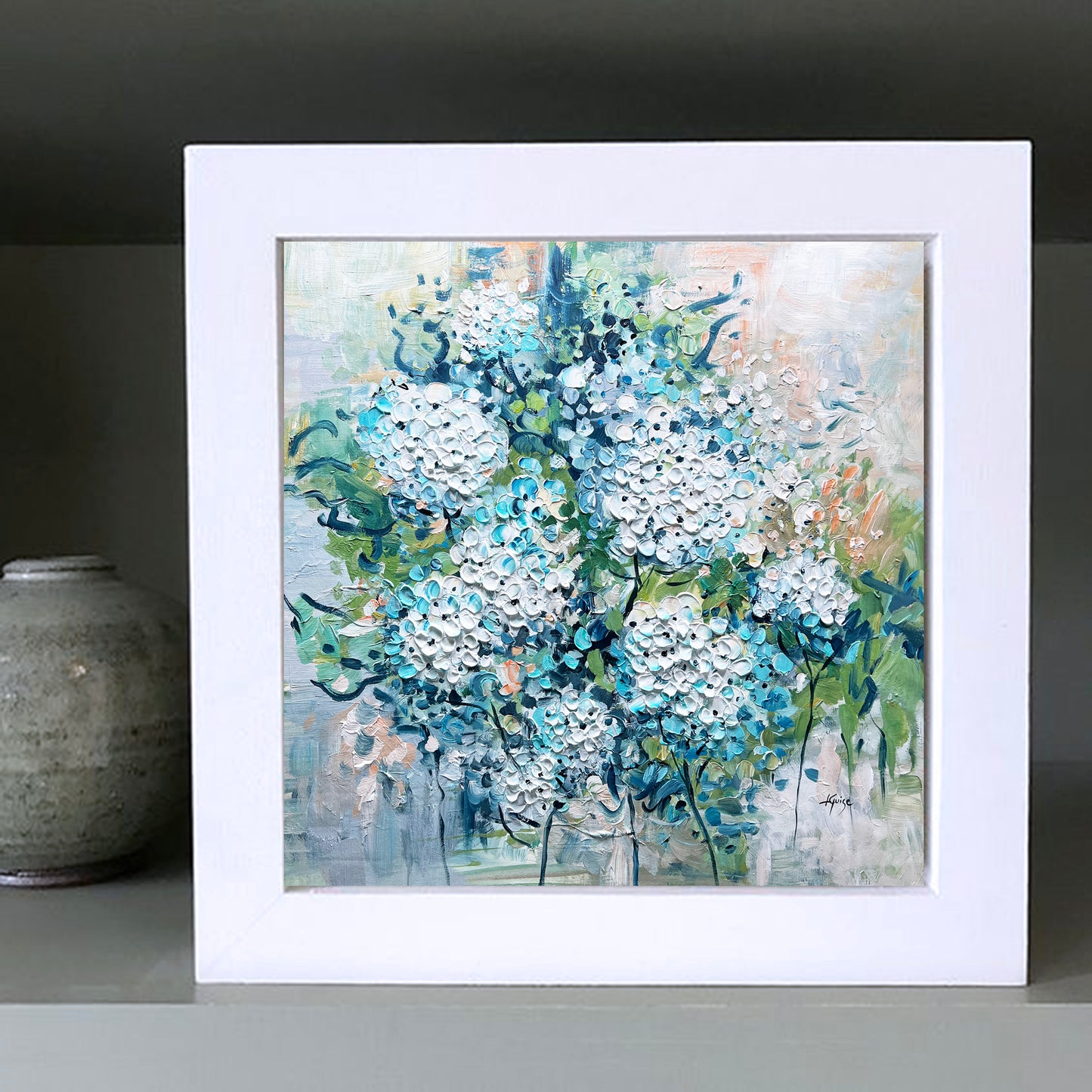 a painting of blue flowers on a shelf