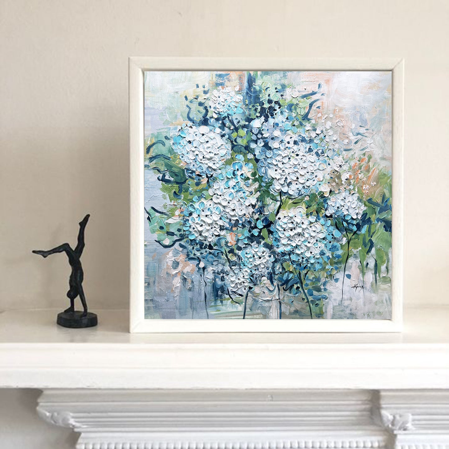 a painting of blue and white flowers on a mantle