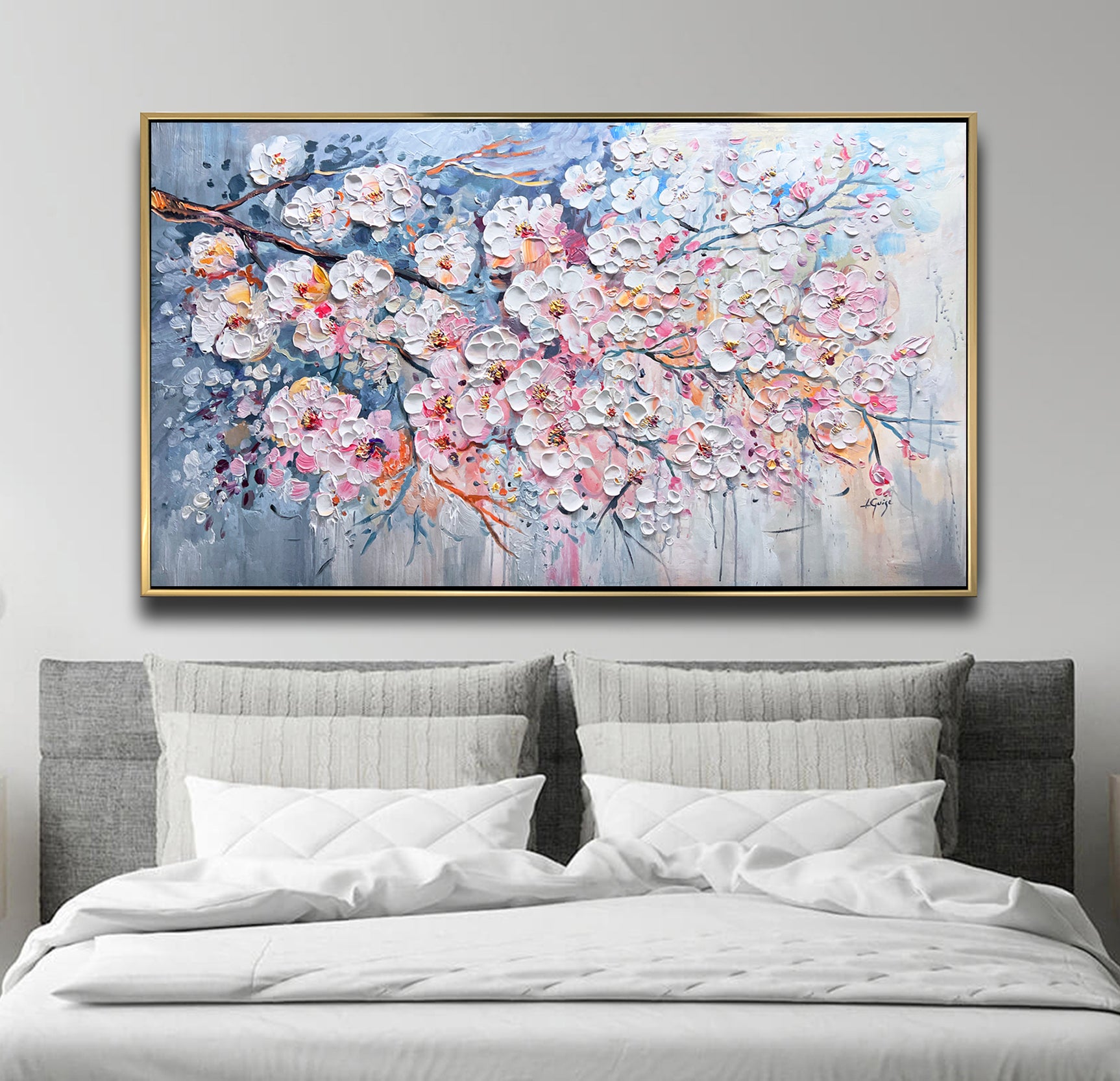 a large painting on a wall above a bed