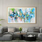 a living room with a large painting on the wall