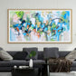 a living room filled with furniture and a painting on the wall