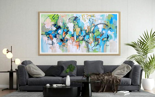 a living room filled with furniture and a painting on the wall